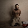 A suspected Islamic State fighter in a basement as Iraqi forces continue their advance against Islamic State militants in Mosul, Iraq, July 3, 2017