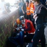 An injured protester gets help during the demonstration at the G-20 summit in Hamburg, Germany