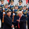 President Donald Trump shakes hands with Chinese President Xi Jinping at a welcoming ceremony in Beijing, Thursday