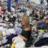 Kathryn Loder sorts donated clothing at George R. Brown Convention Center in Houston, Tuesday