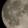 Composite image made from six frames shows the International Space Station as it transits the moon, December 2
