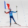 Martin Fourcade, of France winning the gold medal for Team France in the mixed relay biathlon at the 2018 Winter Olympics