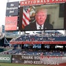 A message from President Donald Trump is shown on the video board before the Congressional baseball game