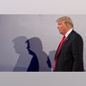 President Donald Trump casts shadows on the wall at the end of a joint press conference with Poland's President Andrzej Duda, in Warsaw