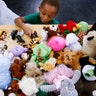 Jacob Evans, 4, picks out a toy at the George R. Brown Convention Center, Wednesday, in Houston