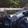 German riot police use water cannons against protesters during demonstrations at the G-20 summit in Hamburg, Germany