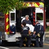 Rep. Roger Williams, R-Texas is placed into an ambulance at the scene of a shooting at a baseball field in Alexandria, Va