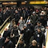Commuters leave the New York Port Authority Bus Terminal in New York City after an explosion, Monday