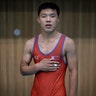 Wrestler Hwang Myong Hyok, 19, poses for a portrait in Pyongyang, North Korea, August 29, 2014