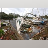 A sinking boat is surrounded by debris in the aftermath of Hurricane Irma at Sundance Marine in Palm Shores, Fla., Monday