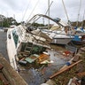 A sinking boat is surrounded by debris in the aftermath of Hurricane Irma at Sundance Marine in Palm Shores, Fla., Monday