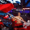 Pita Taufatofua carries the flag of Tonga during the opening ceremony of the 2018 Winter Olympics in Pyeongchang