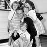 Evangelist Billy Graham poses with his his wife, Ruth, and their three daughters on the Queen Mary in New York, July 7, 1954