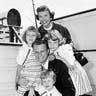 Evangelist Billy Graham poses with his his wife, Ruth, and their three daughters on the Queen Mary in New York, July 7, 1954