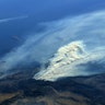 A photo taken from the International Space Station shows smoke rising from a wildfire burning in Southern California, Wednesday
