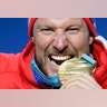 Aksel Lund Svindal of Norway with his gold medal after winning the men's downhill at the 2018 Winter Olympics