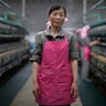 Kim Jong Sil, 35, a worker at the Kim Jong Suk Silk Mill for the past 17 years, poses for a portrait in Pyongyang, North Korea, May 9, 2016