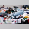 Zyreanna Richards, 1, plays on a cot at the George R. Brown Convention Center, Wednesday, in Houston