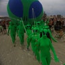 Participants march in costumes at the annual Burning Man arts and music festival in the Black Rock Desert of Nevada, August 29