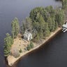 1300 State Highway 32, Three Lakes, WI. For Sale: $1,950,000. Forget one island, how about three? Three islands create the barrier between Wisconsin’s Laurel and Medicine Lakes and they’re looking for new owners. The west island holds two boathouses and the main home, a 5-bedroom, 4-bath stone house built in 1934. The home features white oak floors and a stone wood burning fireplace, but, according to the property listing, the home is in need of updates. The middle island holds various outbuildings, and the east island is mostly lowland, home to much of the area’s wildlife. So, what’s the cost of island living in Three Lakes, WI? This home was previously listed on the Three Lakes real estate market for $4.2 million; a recent price cut dropped it down 53.6 percent to $1.95 million.