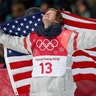 Kyle Mack of the USA celebrates with his national flag