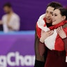 Tessa Virtue and Scott Moir of Canada during the venue ceremony after winning the gold medal in the ice dance at the Winter Olympics