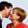 German Chancellor Angela Merkel greets Canada's Prime Minister Justin Trudeau at the beginning of the G-20 summit in Hamburg, Germany