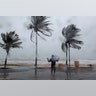 A man in the winds and rain as Hurricane Irma slammed across islands in the northern Caribbean on Wednesday, in Luquillo, Puerto Rico