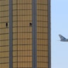 Air Force One flies past the broken windows Stephen Paddock used to shoot from at the Mandalay Bay hotel, in Las Vegas, October 4