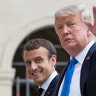 French President Emmanuel Macron and U.S. President Donald Trump leave Les Invalides museum in Paris, Thursday