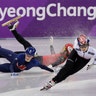 Choi Min-jeong races ahead of Elise Christie and Li Jinyu during the 1500 meters short track