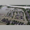 Homes are surrounded by floodwaters from Tropical Storm Harvey Tuesday, in Spring, Texas