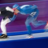 Mia Manganello of the United States, left, and Francesca Lollobrigida of Italy  during the women's 1,500 meters speedskating race