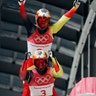 Tobias Arlt and Tobias Wendl of Germany celebrate their gold medal winning run in men's double luge at the Winter Olympics