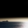 The moon passes between the sun and the earth during a solar eclipse in Valparaiso City, Chile, July 11, 2010