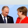 German Chancellor Angela Merkel welcomes Russia's President Vladimir Putin at the G-20 summit in Hamburg, Germany 