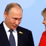 German Chancellor Angela Merkel welcomes Russia's President Vladimir Putin at the G-20 summit in Hamburg, Germany 