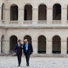 French President Emmanuel Macron and President Donald Trump speak as they leave Les Invalides museum in Paris