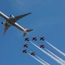 Turkish Stars F5 fighter airplanes fly with a passenger plane during the Teknofest aviation fair in Istanbul, September 22, 2018