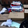 Clothing is laid out for residents of the apartment building destroyed by the fire in West London