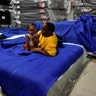 Jakobe Thomas with his sister Journey Thomas at Gallery Furniture where they were evacuated to in Houston, Tuesday