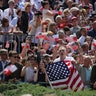 People wave Polish and U.S. flags during U.S. President Donald Trump's public speech at Krasinski Square in Warsaw, Poland