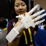 Anna Choi of Neofect demonstrates the Rapael Smart Glove therapy device for stroke victims at CES in Las Vegas.