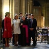 First Lady Melania Trump and French President's wife Brigitte Macron with Notre Dame Cathedral rector Patrick Chauvet in Paris