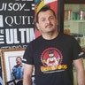 Fabricio Ramirez next to chapo altar