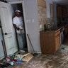 Craig Hardy helps clean out the home of Michael Boyd