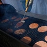 Burger meat on a Grill, Reuters