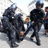German police remove protesters who blocked a street during a demonstration at the G20 summit in Hamburg, Germany, July 7