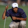 Tiger Woods Lines Up Putt 