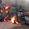 A lava flow advancing down a road is seen from less than 10 feet away in the Leilani Estates subdivision near Pahoa, Hawaii, May 7, 2018